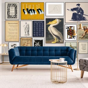 a living room filled with furniture and pictures on the wall