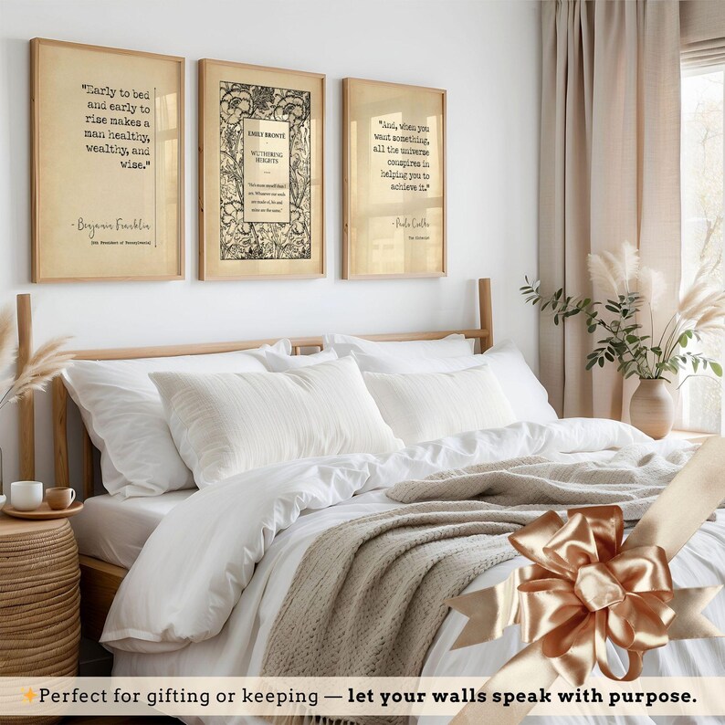 a bedroom with a bed, framed quotes, and a decorative bow on the bed.