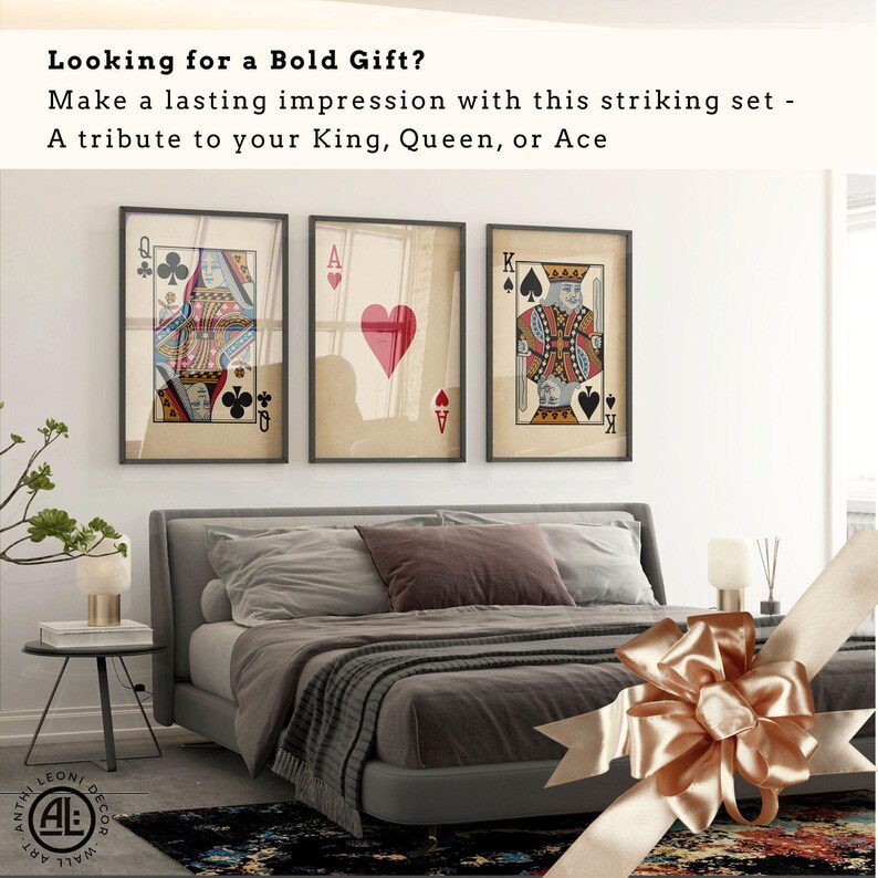 Set of three vintage-style playing card wall art prints featuring the Queen of Clubs, Ace of Hearts, and King of Spades, displayed above a modern grey bed with warm lighting and gift ribbon – a bold bedroom gift idea for card lovers or romantic partners.