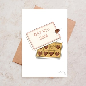 Carte de bon rétablissement avec une boîte remplie de chocolats facétieux “Get well soon”