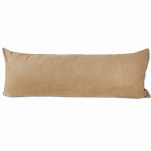 May include: A long, rectangular, tan-colored body pillow. The pillow is made of a soft, plush fabric.