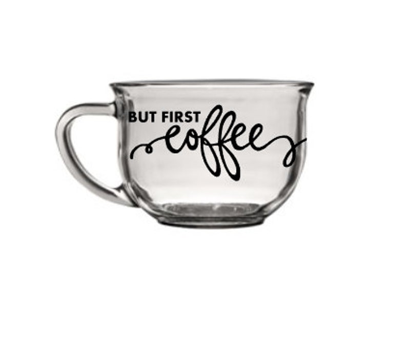 May include: A clear glass mug with a black handle and the text "But First Coffee" in a cursive font.