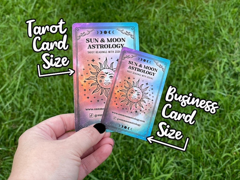 May include: Two business cards with a galaxy background. The larger card is labelled "Tarot Card Size" and the smaller card is labelled "Business Card Size". Both cards feature a sun and moon design with the text "Sun & Moon Astrology" and website information.