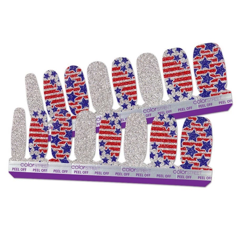 May include: A set of 10 nail polish wraps featuring a silver glitter background with red and blue stripes and blue stars, resembling the American flag. The wraps are labelled "colorSTREET" and "PEEL OFF".