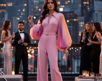 May include: A pink jumpsuit with a collared neckline, a belt, and wide-leg pants. The sleeves are long and balloon-shaped, transitioning from pink to orange. The background features a city skyline at night, with people in formal attire.