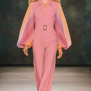 A stunning dusty pink 1970s style Studio 54 flared zip up jumpsuit with chiffon rainbow huge balloon sleeves. We pre pay USA tariffs
