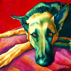 May include: A watercolor painting of a German Shepherd dog lying down on a red and pink blanket. The dog's fur is a mix of black, green, and yellow, and its eyes are a bright orange. The dog's head is resting on the blanket, and its paws are outstretched.