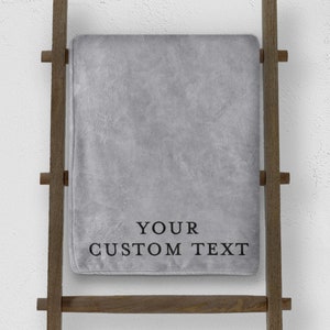 grey custom blanket with custom text