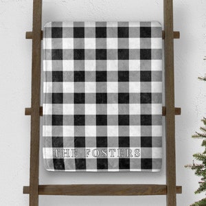 custom white buffalo plaid christmas throw blanket personalized with last name on blanket ladder