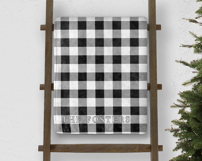 custom white buffalo plaid christmas throw blanket personalized with last name on blanket ladder