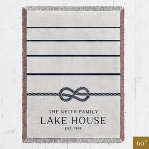 custom blue and white lakehouse woven throw blanket personalized with family name and established year