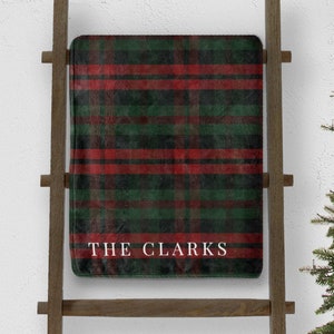 custom green and red plaid christmas throw blanket personalized with last name on blanket ladder