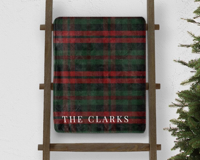 custom green and red plaid christmas throw blanket personalized with last name on blanket ladder