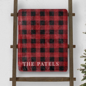 custom red buffalo plaid christmas throw blanket personalized with last name on blanket ladder