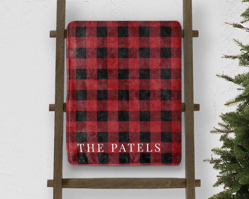 custom red buffalo plaid christmas throw blanket personalized with last name on blanket ladder