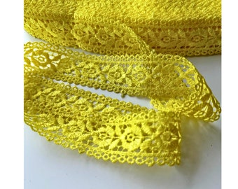 May include: Yellow crochet lace trim with a delicate floral pattern.