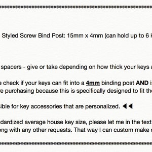 May include: A close-up of a text description for a key holder product. The text describes the product's features, including a leather key holder, a space gray nickel plated dumbbell styled screw bind post, a nickel plated D-ring, and rubber spacers. The text also includes important information about the size of the key holder and the fact that it is designed to fit standard house keys. The text also mentions that no returns, refunds, or exchanges are possible for personalized key accessories.