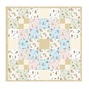 May include: A square patchwork quilt featuring a repeating pattern of Peter Rabbit characters, trees, and garden elements in soft pastel shades of blue, pink, green, and cream. The design includes solid tan squares and a tan border frame.