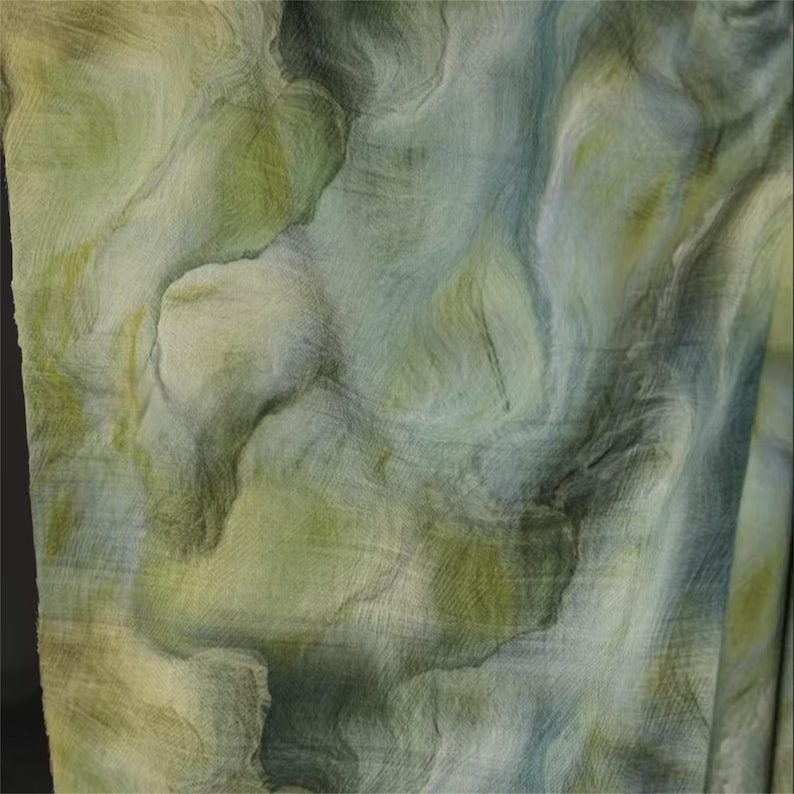 May include: Abstract textile with a watercolor effect. The fabric features a blend of green, blue, and yellow hues, creating a marbled or flowing pattern. The texture appears soft and slightly translucent, suggesting a lightweight material.