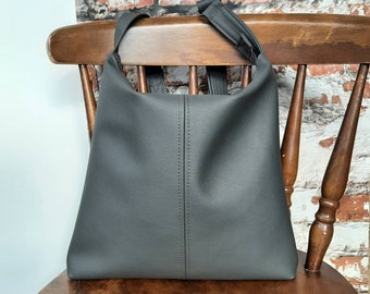 Grey charcoal hobo handbag with adjustable strap for shoulder or crossbody in PU vegan leather. slouch bucket bag