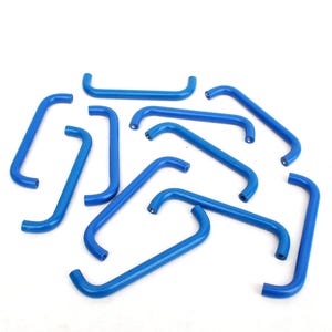 May include: A collection of blue, curved metal handles, each with a rounded shape. The handles are scattered on a white background. The handles appear to be made of a solid material and are uniformly colored.
