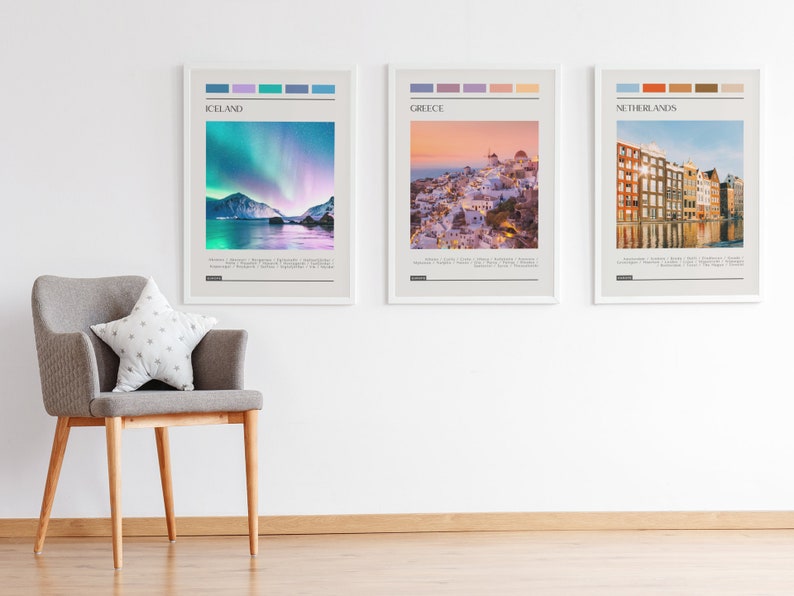 May include: Three framed travel posters with colorful stripes at the top and a scenic image below. The posters are titled "Iceland", "Greece", and "Netherlands".