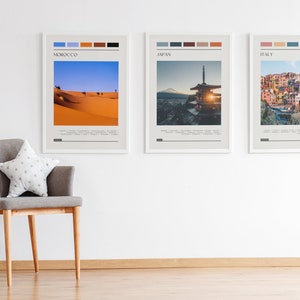 May include: Three framed travel posters with a minimalist design. Each poster features a different country: Morocco, Japan, and Italy. The posters include a color palette and the country name in a sans-serif font.