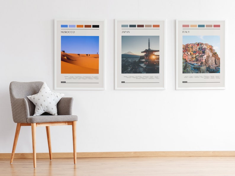 May include: Three framed travel posters with a minimalist design. Each poster features a different country: Morocco, Japan, and Italy. The posters include a color palette and the country name in a sans-serif font.