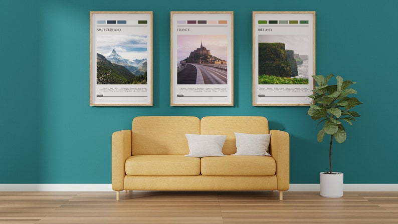 May include: Three framed travel posters with color palettes and images of Switzerland, France, and Ireland. The posters are hanging on a teal wall above a yellow couch. A potted plant is on the right side of the image.