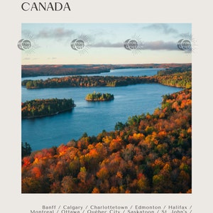 May include: Aerial view of a lake surrounded by fall foliage in Canada. The water is a deep blue, and the trees are a mix of red, orange, yellow, and green. The image includes the text "CANADA" and a list of Canadian cities.