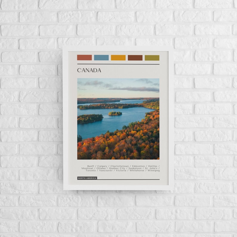 May include: A poster with a photo of a lake surrounded by trees in autumn colors. The poster has a title that says "CANADA" and lists major cities in Canada. The poster also has a color palette at the top.