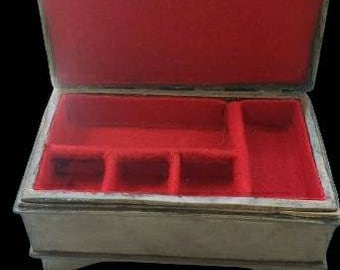 Beautiful, simple brass jewelry box with red felted interior
