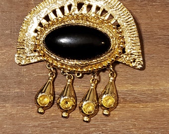 Gold tone vintage 80s pin with dangling charms and black stone