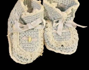 Sweet little pair of hand crocheted vintage baby booties in powder blue