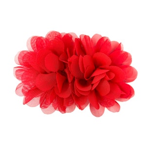 May include: A red fabric flower with multiple layers of petals. The flower is made of a soft, sheer material and has a delicate, feminine look.