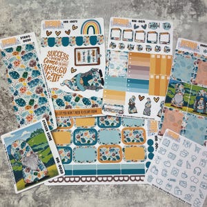 May include: A set of planner stickers featuring gnomes, rainbows, and floral patterns. The stickers are designed for use in a planner or journal. The stickers are printed on high-quality vinyl and are waterproof and tear-resistant.