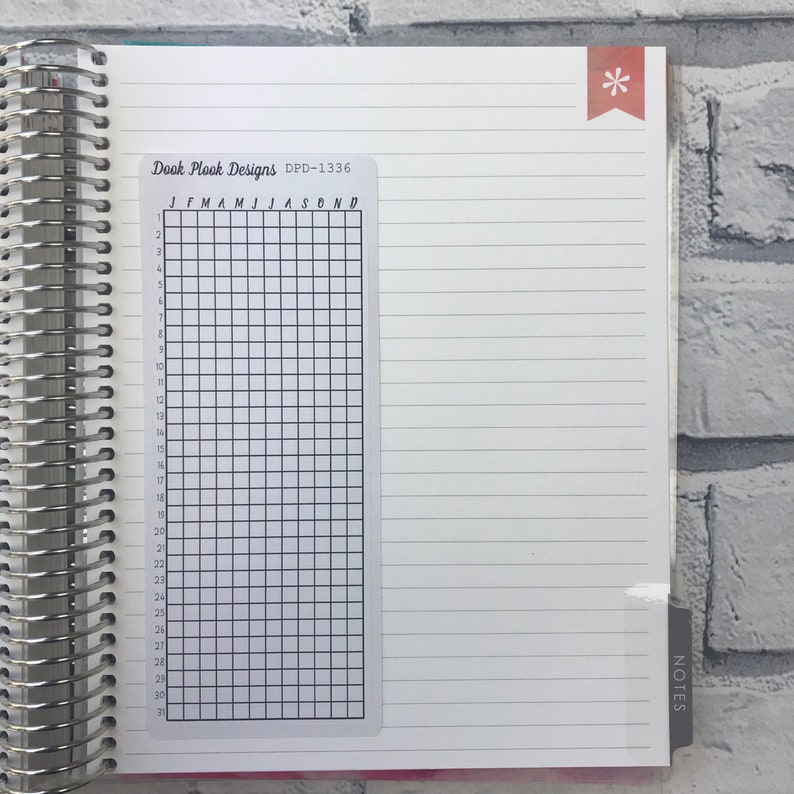 May include: A clear plastic sheet with a grid of squares and the months of the year labeled across the top. The sheet is labeled "Dook Plook Designs DPD-1336".