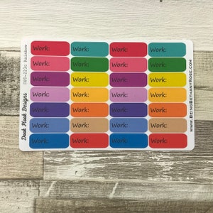 Op de afbeelding: Een vel met kleurrijke stickers met het woord "Work:" op elke sticker. De stickers zijn gerangschikt in een raster van 4 rijen en 3 kolommen. De kleuren van de stickers zijn rood, oranje, geel, groen, blauw, paars, bruin en beige.