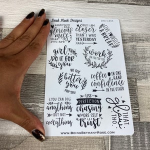 May include: A sheet of white stickers with black lettering and illustrations. The stickers feature motivational quotes such as "Embrace the glorious mess that you are", "Girl, do it for you", "Be the better you", "You can do anything but not everything", "Less perfection chasing more self trust", "Work on you for you", "Give yourself a break", "Coffee in one hand confidence in the other", and "That, too".