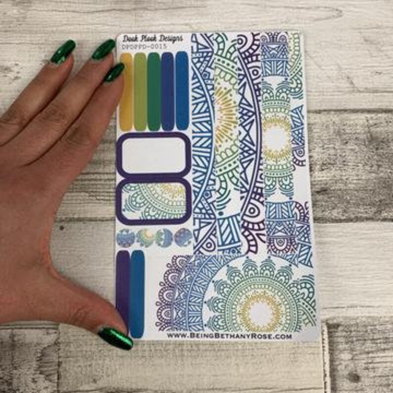 May include: A sheet of colorful planner stickers featuring mandala designs in shades of blue, green, and purple. The stickers include various sizes and shapes, including circles, squares, and rectangles. The text "DPCPD-0015" is printed in the top right corner.