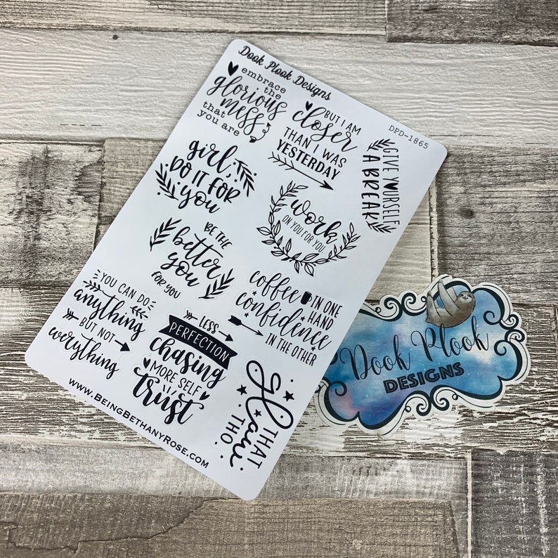 May include: A sheet of white vinyl stickers with black lettering. The stickers feature motivational quotes and phrases such as "embrace the glorious mess", "girl do it for you", "be the better you", "you can do anything but not everything", "less perfection chasing more self trust", "work on you for you", "coffee confidence", "but I am closer than I was yesterday", "give yourself a break", "in one hand coffee confidence in the other", "oh that I am", and "Dook Plook Designs".