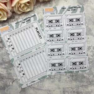 May include: A set of printable planner stickers featuring a cassette tape design. The stickers are black and white and have the text "TAPES - MUSIC TRACKERS BBR-0030" and "PLAYLIST" on them.