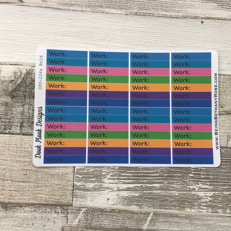 Op de afbeelding: Een vel met kleurrijke planner stickers met het woord "Work:" herhaald op elke sticker. De stickers zijn in blauw, roze, groen, oranje en paars.