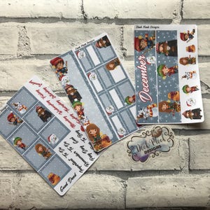 May include: A set of Harry Potter themed planner stickers featuring characters from the books and films. The stickers are on a grey background with a snowflake pattern. The stickers include the words "December", "Good Deed", "To Do", "Pay Day Goal", "Monday", "Tuesday", "Wednesday", "Thursday", "Friday", "Saturday", "Sunday", and "Important".