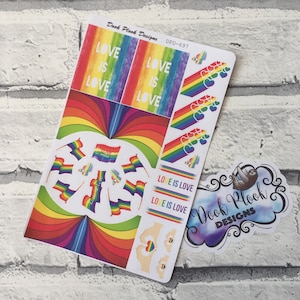 May include: A sheet of rainbow-themed stickers. The stickers include the text "LOVE IS LOVE", rainbow flags, and heart designs. The sheet is labelled "Dook Plook Designs". The stickers are in various shapes and sizes.