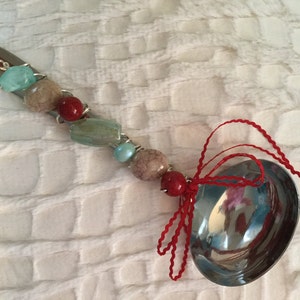 Jeweled Stainless Steel Soup Ladle.  Ladle Handle is Embellished with Blue and Tan Precious Stones, and Red Beads.  Perfect Soup Ladle.!!