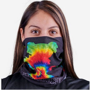 May include: Black face covering with a colorful tie-dye bear design. The bear is in shades of green, yellow, red, and blue. The face covering also has white text along the bottom edge.