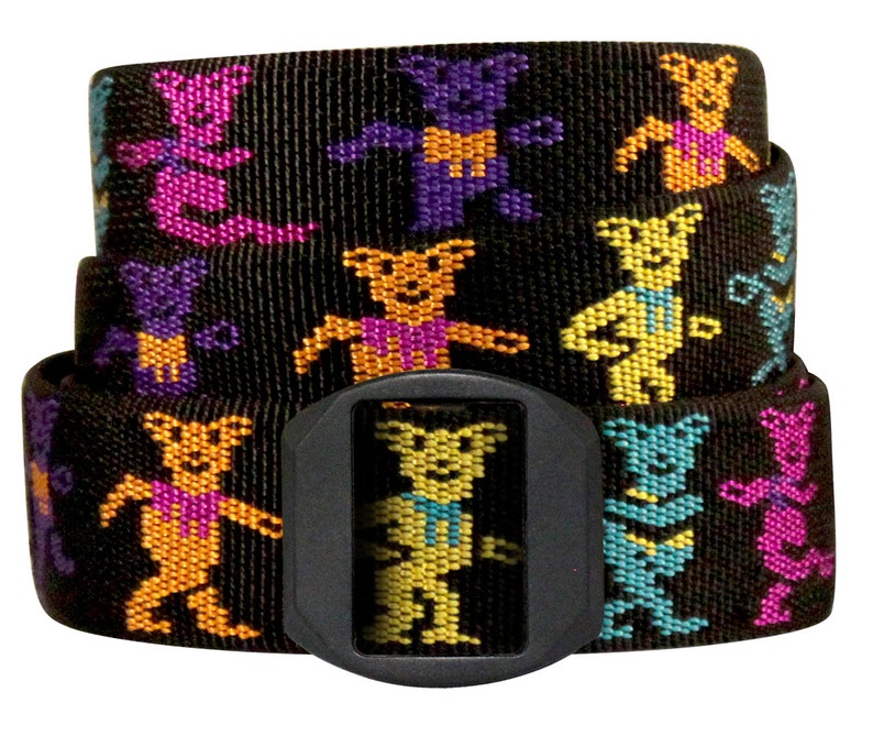 May include: Black woven belt with a repeating pattern of colourful dancing bears in shades of purple, orange, yellow, and teal. The belt has a black plastic buckle. The belt is approximately 3.8 cm wide.
