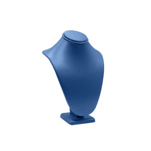 May include: A blue velvet necklace display stand with a round top and a square base.