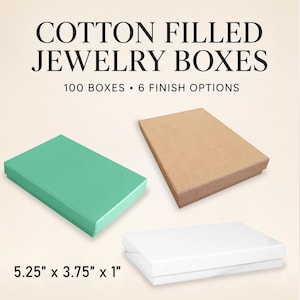 May include: A set of cotton filled jewelry boxes featuring 100 boxes with 6 finish options. The image displays three rectangular boxes in mint green, brown kraft, and white. Each box measures 5.25 inches by 3.75 inches by 1 inch in size.